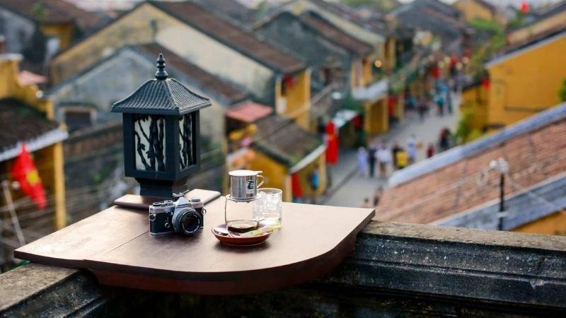 Rooftop cafes offer a panoramic view of the ancient Hoi An town