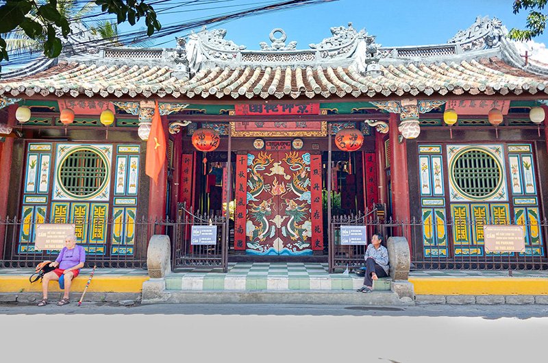 Quan Cong Temple stands out with its aged red walls and solemn worship space