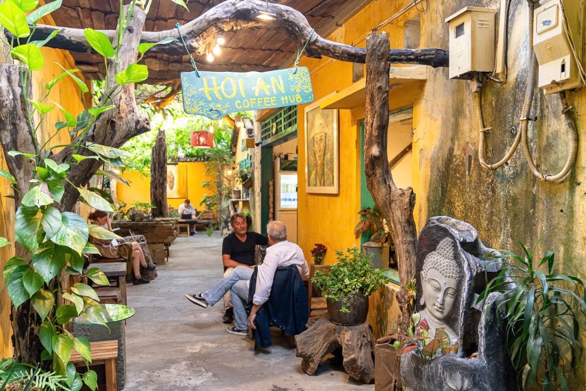 Hoi An Coffee Hub in Nguyen Thai Hoc Alley stands out with a peaceful garden corner and rustic old town charm