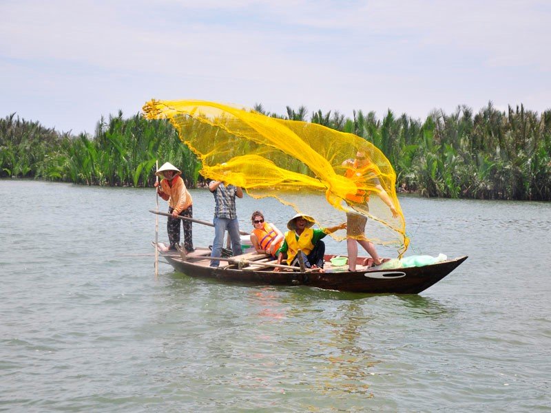 Visitors trying their hand at casting fishing nets and setting nets