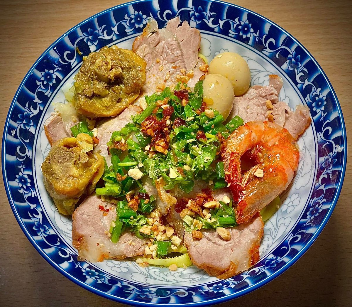 Mi Quang at MINH features shrimp, pork, quail eggs, and bold seasoning that evokes traditional Hoi An flavors