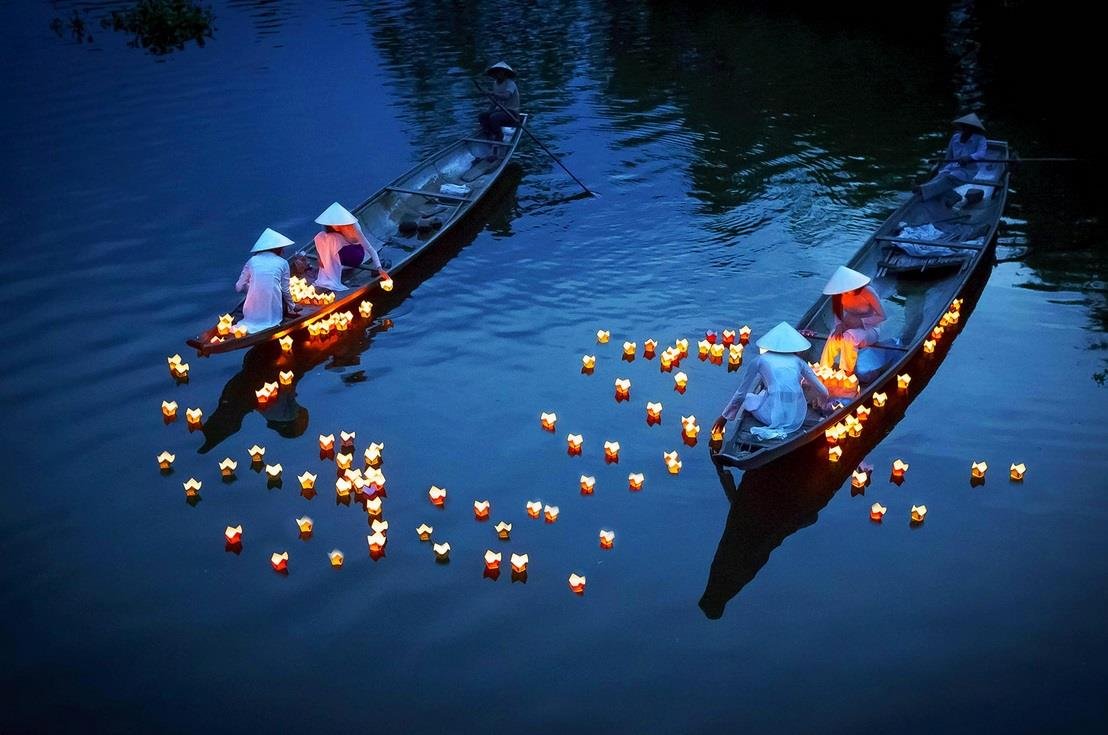 Releasing floating lanterns on the Hoai River is a classic Hoi An evening experience.